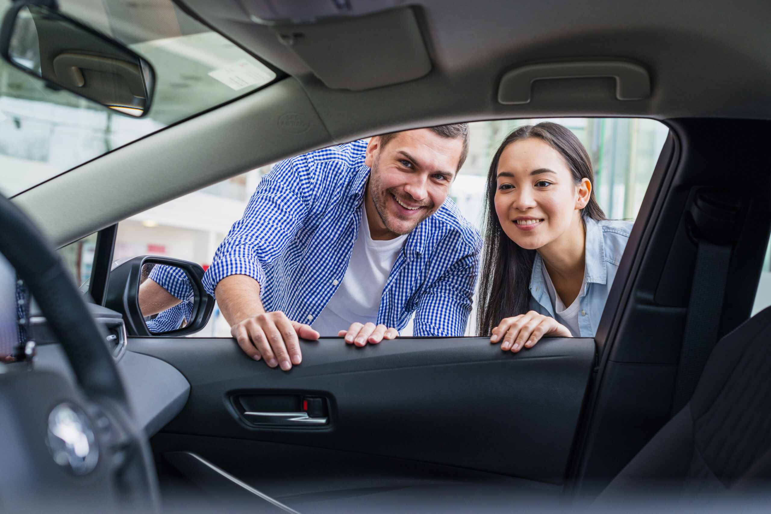 happy-couple-car-dealership